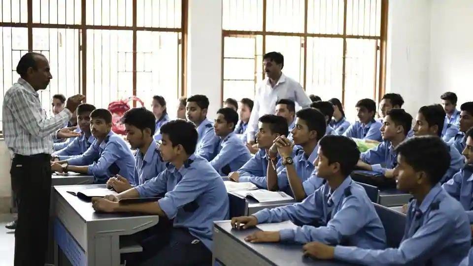 High school students working on computers in modern lab